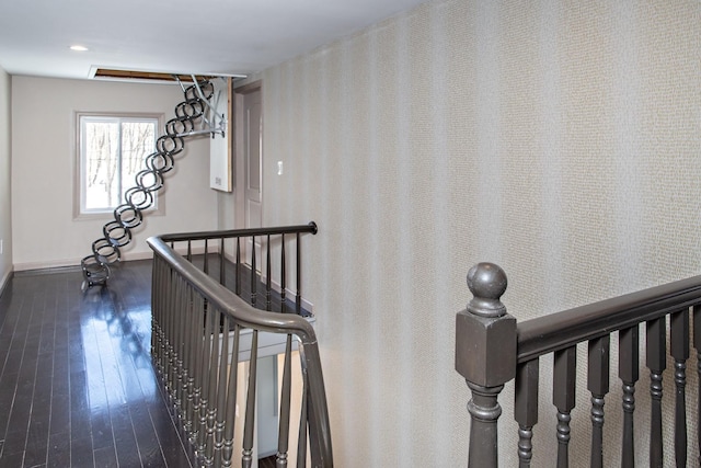 staircase with baseboards and hardwood / wood-style flooring
