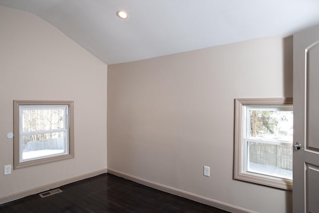unfurnished room featuring dark wood finished floors, vaulted ceiling, baseboards, and recessed lighting