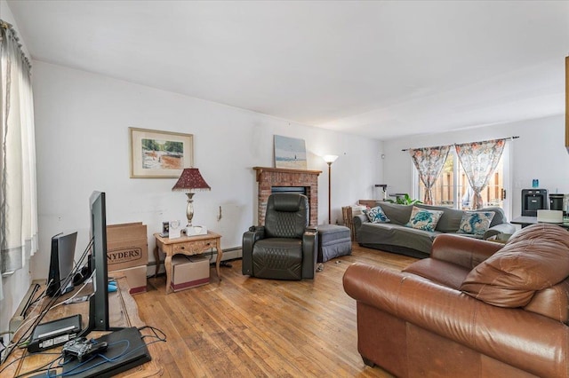 53 Shore Rd, Hampton Bays, NY 11946 - living area featuring light wood-style floors and a fireplace
