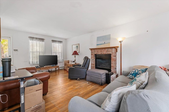 53 Shore Rd, Hampton Bays, NY 11946 - living area featuring light wood-type flooring and a brick fireplace