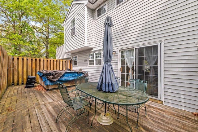 53 Shore Rd, Hampton Bays, NY 11946 - wooden deck featuring outdoor dining area, a covered hot tub, and fence