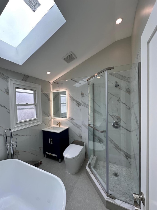 40 Allen St, New Hyde Park, NY 11040 - bathroom featuring a marble finish shower, a soaking tub, vanity, toilet, and a skylight