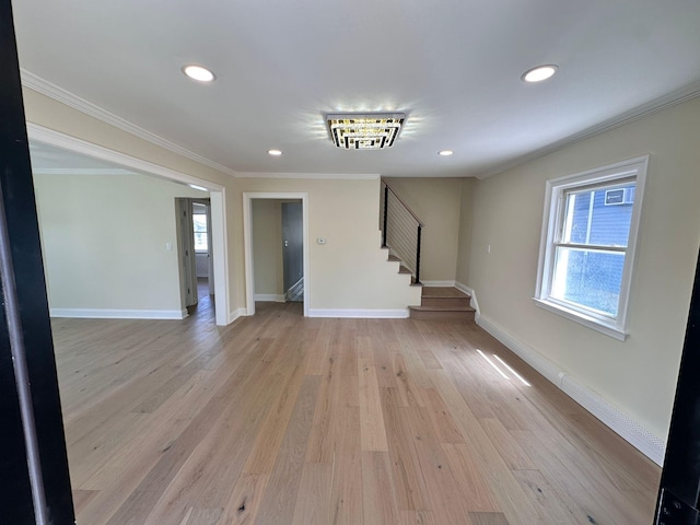 40 Allen St, New Hyde Park, NY 11040 - spare room with stairway, healthy amount of natural light, ornamental molding, recessed lighting, and light wood-style flooring