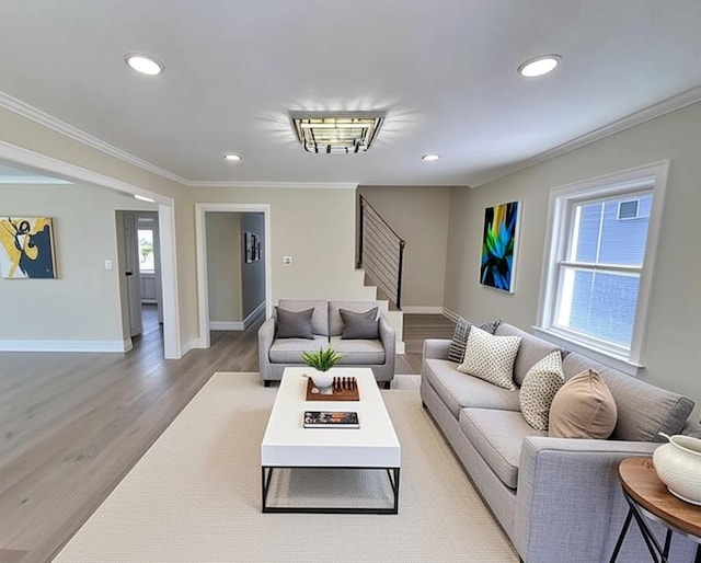 40 Allen St, New Hyde Park, NY 11040 - living room featuring ornamental molding, light wood-style flooring, baseboards, recessed lighting, and stairs
