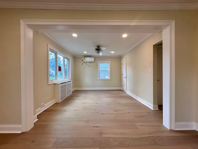 40 Allen St, New Hyde Park, NY 11040 - unfurnished room featuring crown molding, light wood finished floors, a wall mounted air conditioner, baseboards, and a ceiling fan