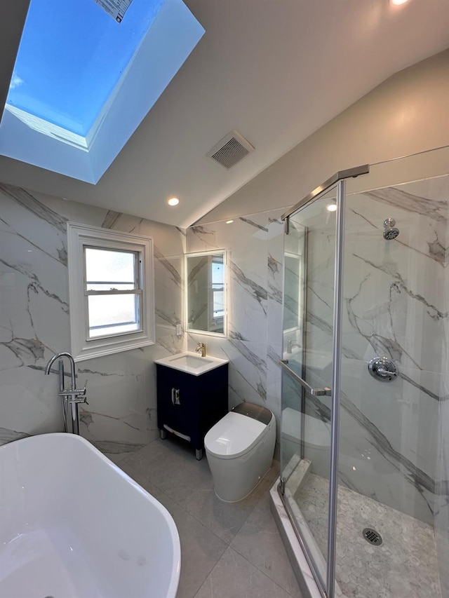 40 Allen St, New Hyde Park, NY 11040 - bathroom with a soaking tub, vanity, a marble finish shower, a skylight, and toilet