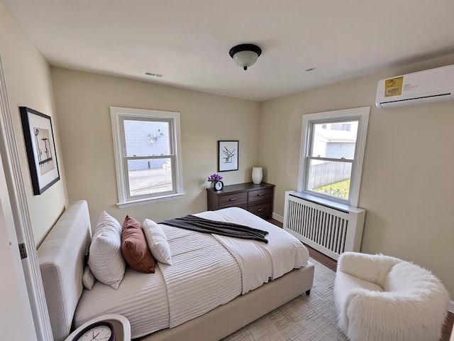 40 Allen St, New Hyde Park, NY 11040 - bedroom featuring radiator heating unit and a wall mounted AC