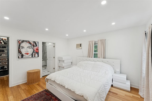 694 The Fenway, Baldwin, NY 11510 - bedroom featuring a spacious closet, light wood-type flooring, recessed lighting, a closet, and baseboards