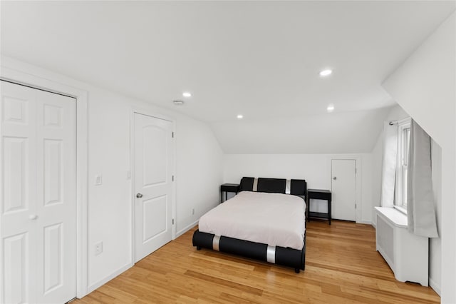 694 The Fenway, Baldwin, NY 11510 - bedroom with light wood-style floors, vaulted ceiling, recessed lighting, and baseboards