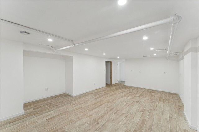 694 The Fenway, Baldwin, NY 11510 - finished basement featuring recessed lighting, light wood-style floors, and baseboards