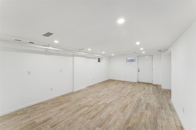 694 The Fenway, Baldwin, NY 11510 - finished basement with recessed lighting, light wood-style floors, and baseboards