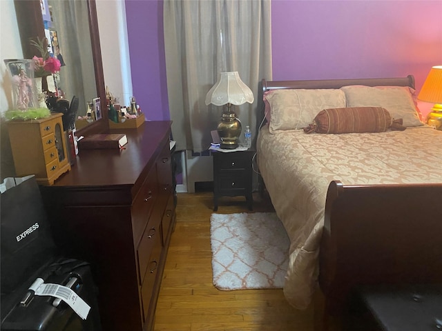 bedroom featuring light wood-style flooring