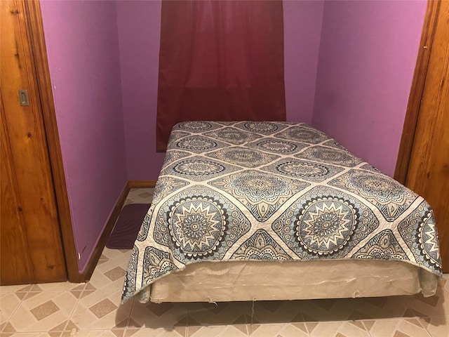 bedroom with tile patterned floors