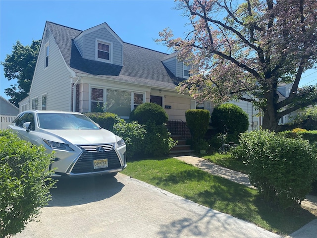 view of front of house with a shingled roof