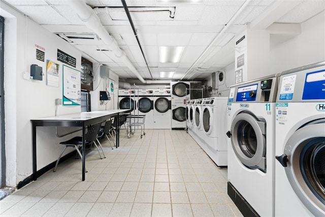 communal laundry room with estacked washer and dryer and washer and dryer