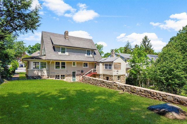 9 Summit Ave, Larchmont, NY 10538 - rear view of house with a chimney, a lawn, and stairway