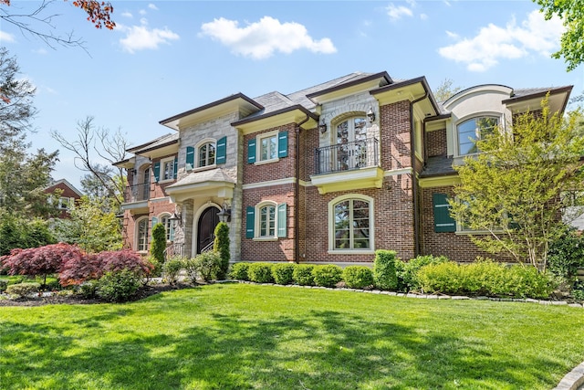 7 Beverly Rd, Kensington, NY 11021 - view of front of home featuring a balcony, brick siding, and a front yard