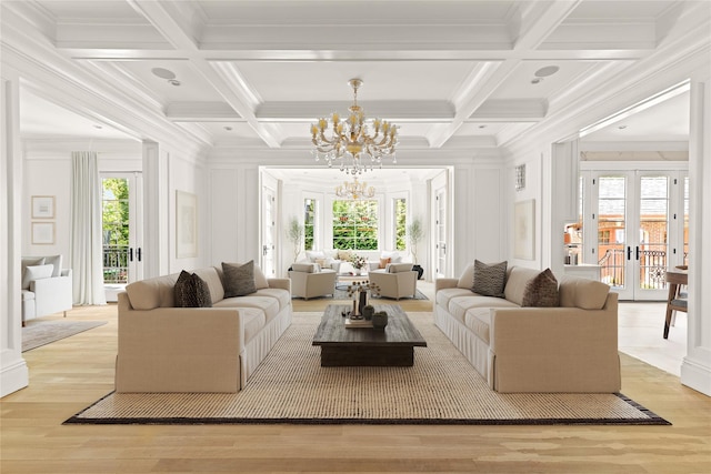 7 Beverly Rd, Kensington, NY 11021 - living area with a decorative wall, a chandelier, ornamental molding, coffered ceiling, and french doors