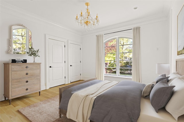 7 Beverly Rd, Kensington, NY 11021 - bedroom with a chandelier, light wood-style floors, and ornamental molding