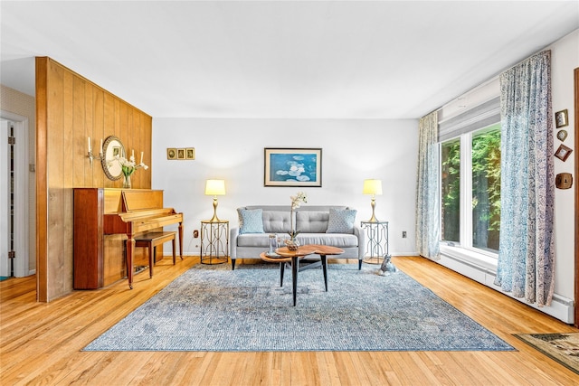 63 Lexington Dr, Croton-On-Hudson, NY 10520 - living area featuring wood finished floors, baseboards, and a baseboard heating unit