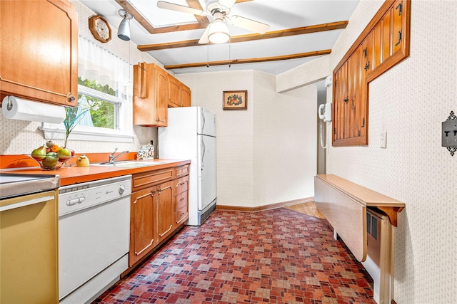 63 Lexington Dr, Croton-On-Hudson, NY 10520 - kitchen featuring white appliances, a sink, a ceiling fan, light countertops, and brown cabinets
