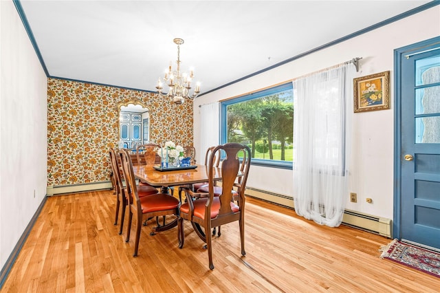 63 Lexington Dr, Croton-On-Hudson, NY 10520 - dining area featuring a chandelier, crown molding, light wood-style flooring, baseboards, and a baseboard radiator