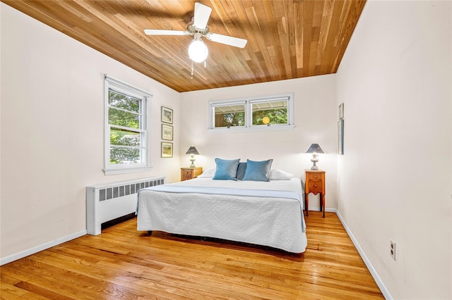 63 Lexington Dr, Croton-On-Hudson, NY 10520 - bedroom featuring radiator heating unit, wooden ceiling, light wood finished floors, baseboards, and ceiling fan