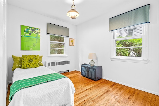 63 Lexington Dr, Croton-On-Hudson, NY 10520 - bedroom with radiator, wood finished floors, and baseboards