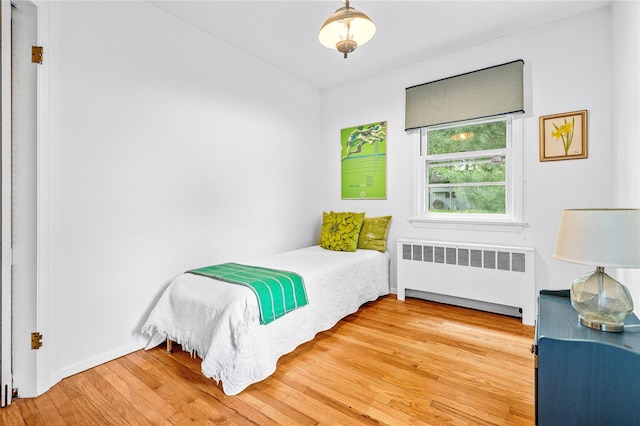 63 Lexington Dr, Croton-On-Hudson, NY 10520 - bedroom featuring radiator and wood finished floors