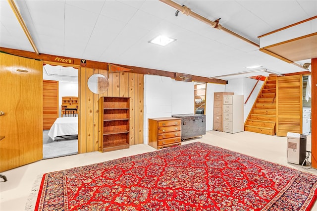 63 Lexington Dr, Croton-On-Hudson, NY 10520 - finished below grade area featuring stairs, wooden walls, and carpet