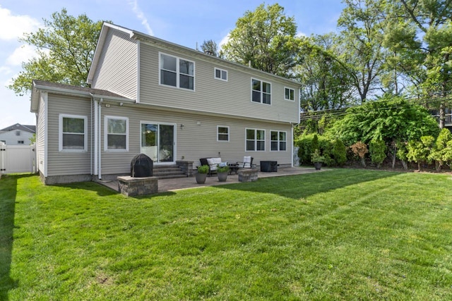 back of house with entry steps and a patio