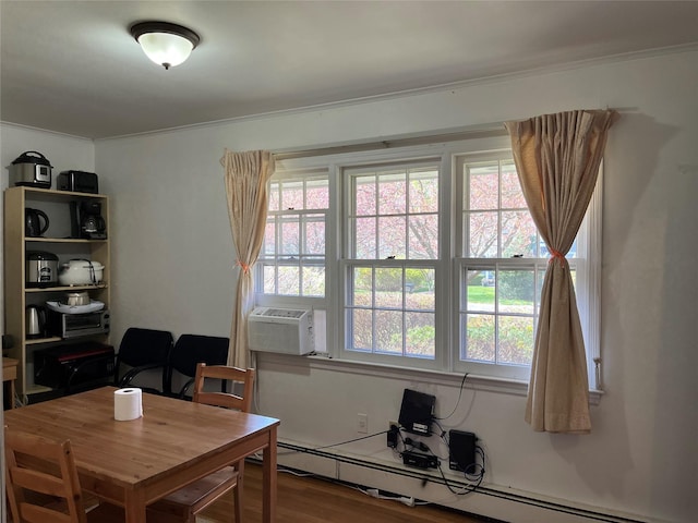 11 Acorn Ln, Stony Brook, NY 11790 - dining space with baseboard heating, ornamental molding, wood finished floors, an office area, and cooling unit