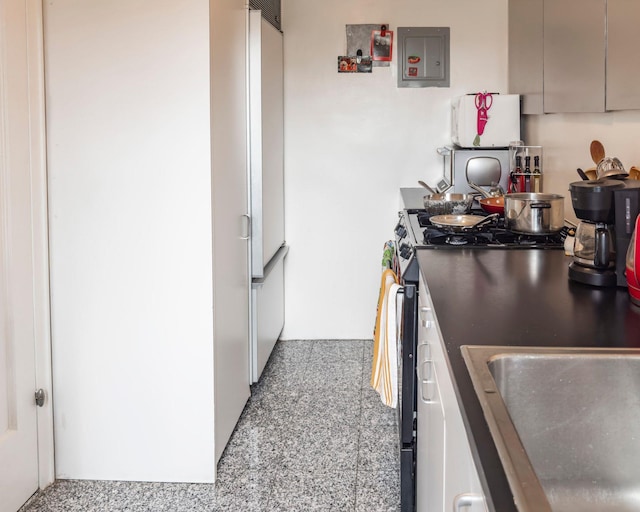 160 Cabrini Blvd Unit 62, New York Manhattan, NY 10033 - kitchen with electric panel, a sink, and freestanding refrigerator