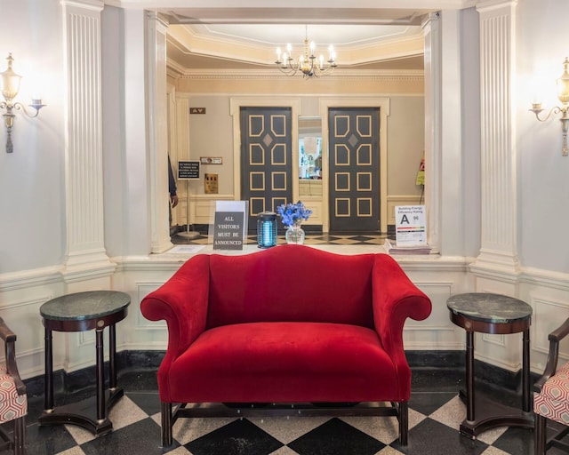 160 Cabrini Blvd Unit 62, New York Manhattan, NY 10033 - sitting room with a decorative wall, crown molding, ornate columns, a chandelier, and a tray ceiling