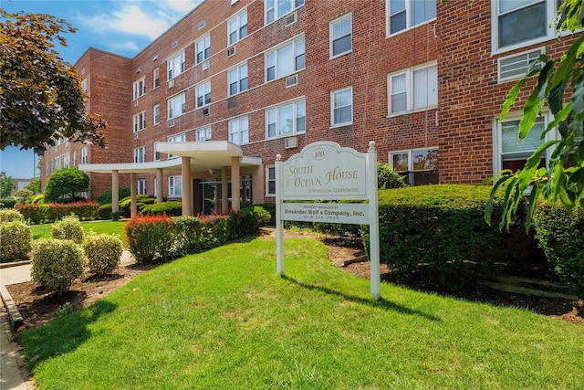 100 S Ocean Ave Unit 2E, Freeport, NY 11520 - community sign featuring a yard