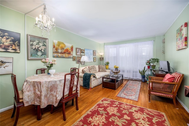100 S Ocean Ave Unit 2E, Freeport, NY 11520 - dining room with hardwood / wood-style flooring and a chandelier