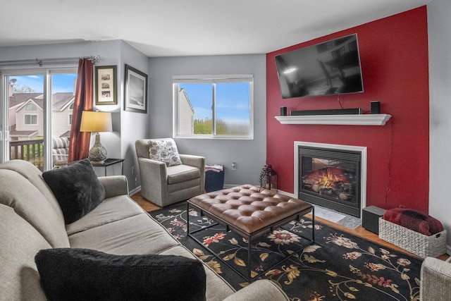 1303 Eagles Ridge Rd, Brewster, NY 10509 - living room with a fireplace with flush hearth and wood finished floors