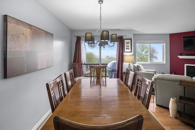 1303 Eagles Ridge Rd, Brewster, NY 10509 - dining space with a chandelier and wood finished floors