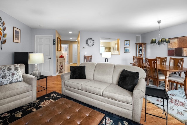 1303 Eagles Ridge Rd, Brewster, NY 10509 - living room featuring a chandelier, wood finished floors, and recessed lighting