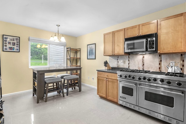 1303 Eagles Ridge Rd, Brewster, NY 10509 - kitchen featuring range with two ovens, a chandelier, baseboards, and backsplash