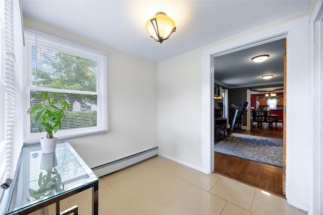 175 N Columbus Ave, Freeport, NY 11520 - dining area featuring baseboard heating, tile patterned floors, and baseboards