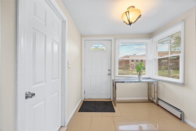 175 N Columbus Ave, Freeport, NY 11520 - entrance foyer featuring baseboard heating, baseboards, and light tile patterned flooring
