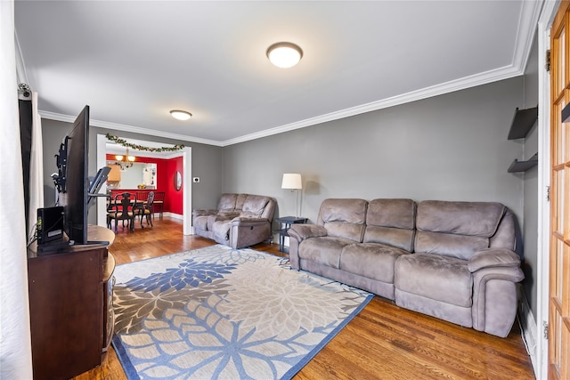 175 N Columbus Ave, Freeport, NY 11520 - living room featuring wood finished floors, crown molding, and baseboards