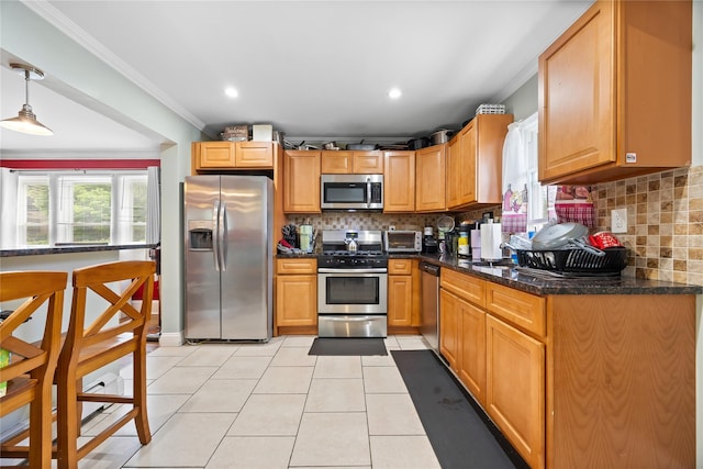 175 N Columbus Ave, Freeport, NY 11520 - kitchen with stainless steel appliances, ornamental molding, plenty of natural light, light tile patterned floors, and decorative backsplash