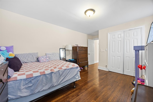 175 N Columbus Ave, Freeport, NY 11520 - bedroom featuring dark wood-style flooring, a closet, and baseboards