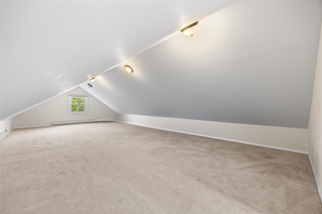 175 N Columbus Ave, Freeport, NY 11520 - additional living space featuring lofted ceiling, carpet flooring, baseboard heating, and baseboards