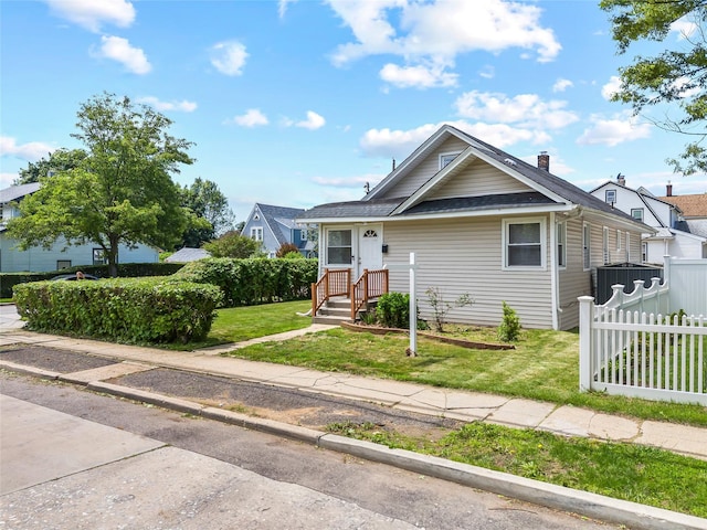 175 N Columbus Ave, Freeport, NY 11520 - view of front facade with a shingled roof