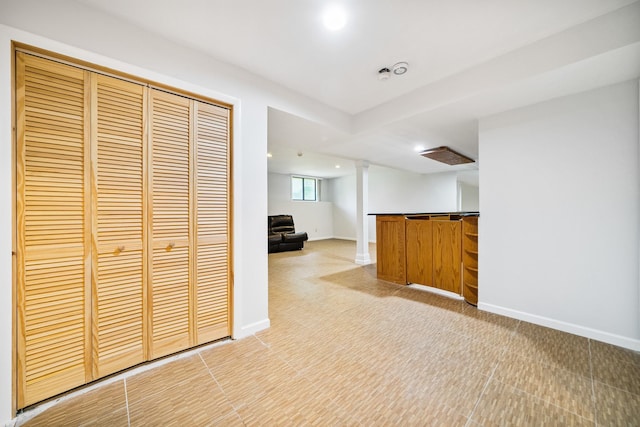 indoor bar with light colored carpet, baseboards, and recessed lighting