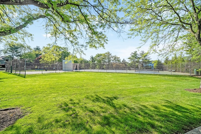 view of yard featuring a tennis court