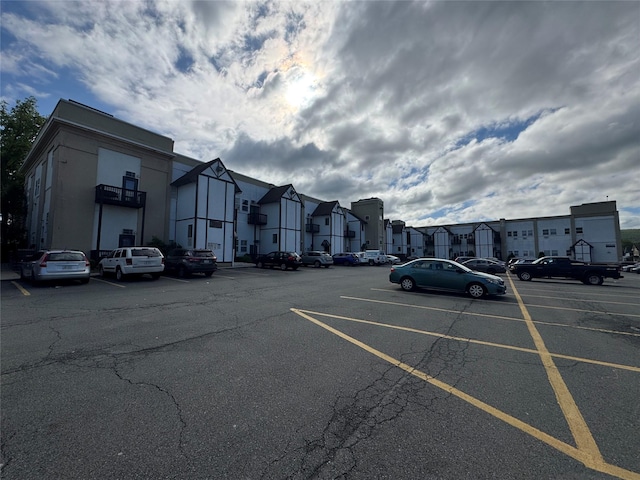 uncovered parking lot with a residential view